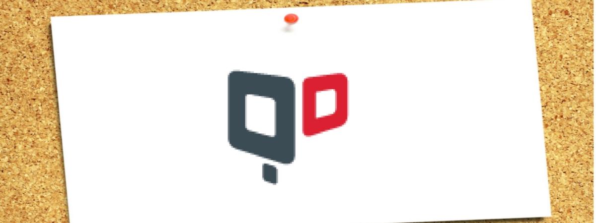 a pinned quantumdigital logo on a cork board as a reminder