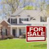 nice home in the country with a for sale sign in front of it