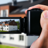 real estate agent creating a virtual tour of a property with a video camera